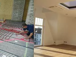 Person verlegt Fußbodenheizung